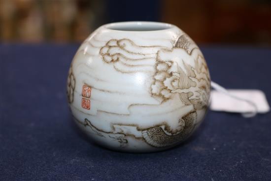 A Chinese miniature water pot and a jar cover